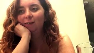 Amateur redhead Jacqueline with glasses masturbates